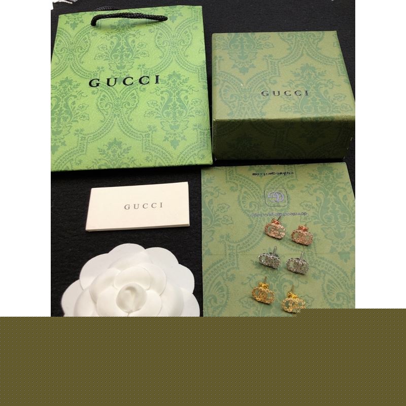 G*u*i earrings